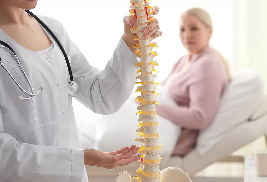woman osteoporosis doctor spine