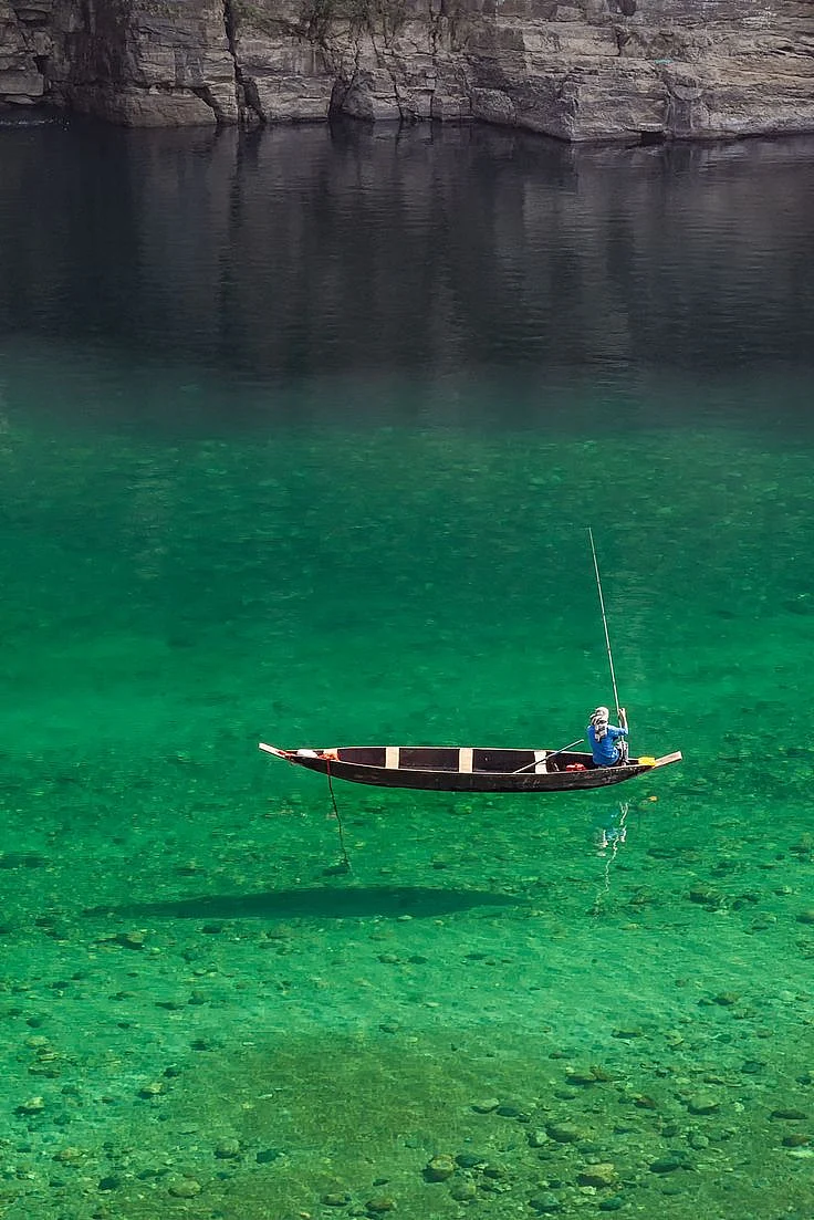 A fisherman at River Umngot Meghalaya India 1622023 1