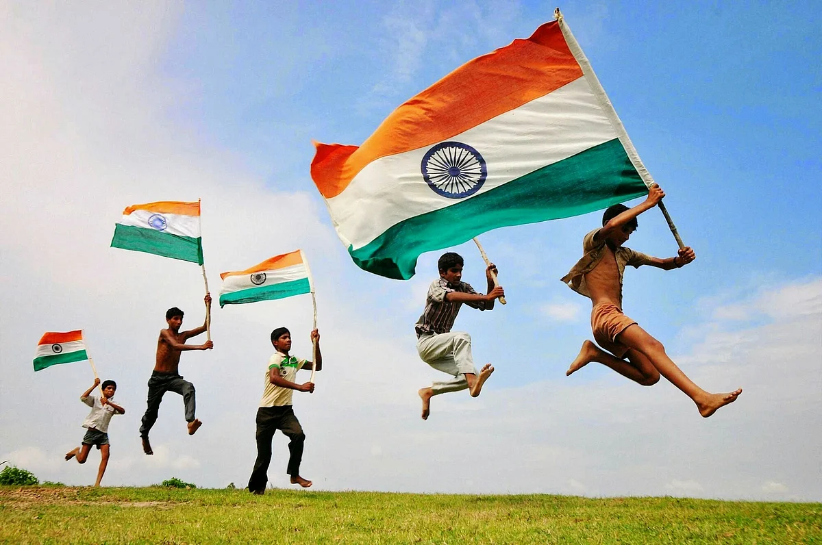 india flag fluttering by kids for Indian Independence day Celebration