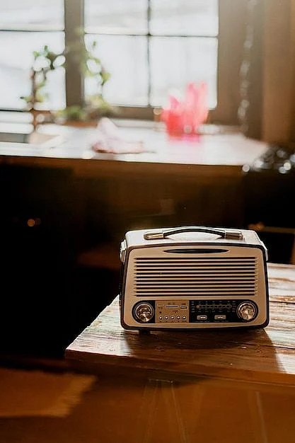 Premium Photo Vintage radio player stands on a wooden table in a bright apartment Daylight from the window
