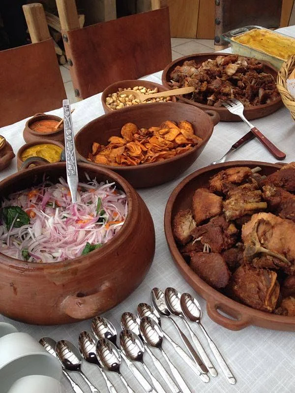 A traditional criollo Peruvian breakfast served in clay pots