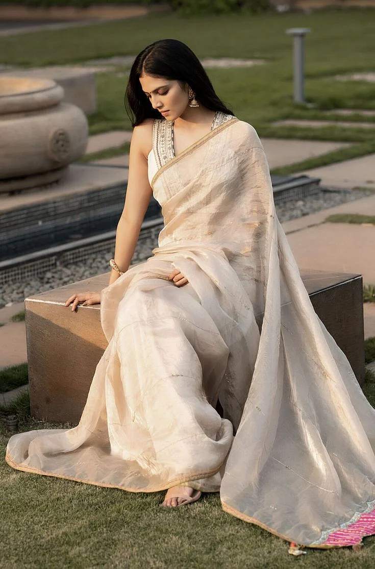 Malavika Mohanan in Ivory Golden tissue saree