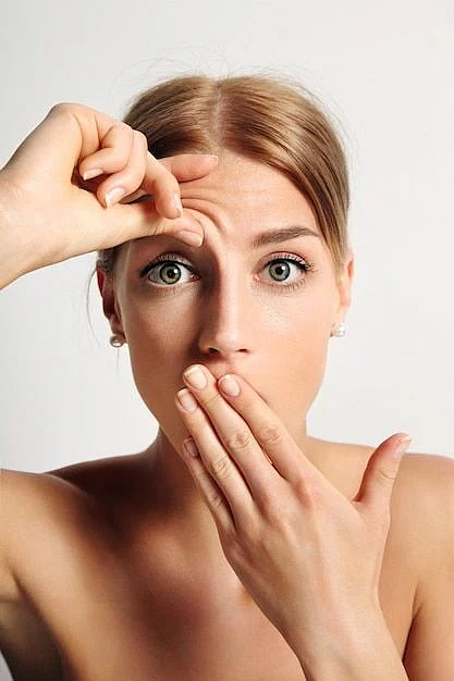 Free Photo Young woman wondering that hse have first wrinkle on her forehead