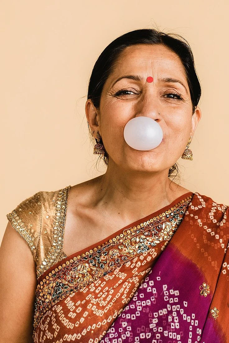 Download premium image of Senior Indian woman in a traditional saree blowing a bubble with a chewing gum by McKinsey about face person saree bubble gum and portrait 2313071