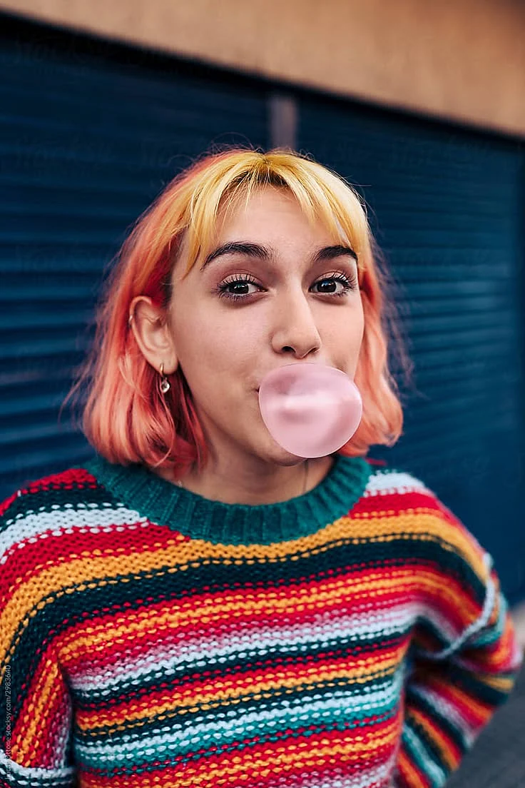 Gen Z Woman Chewing Gum by Stocksy Contributor Lucas Ottone