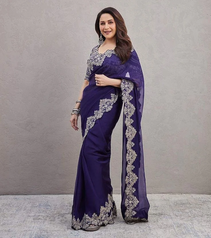 Madhuri Dixits festive look in a purple cut work saree for an event