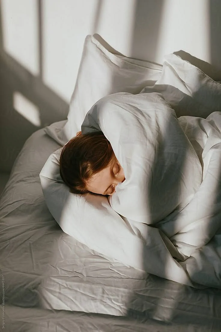 Tranquil Woman Sleep In Bed In Sunny Morning by Stocksy Contributor Serge Filimonov