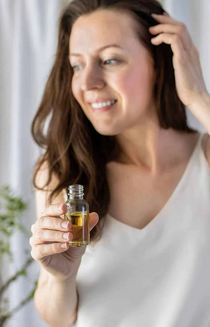 applying oil to the hair 7