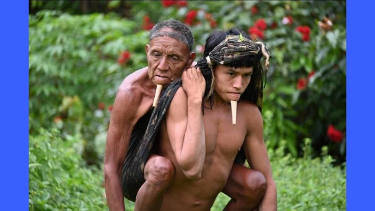 Viral Photo of Brazil Man carries father on his back for 6 hours