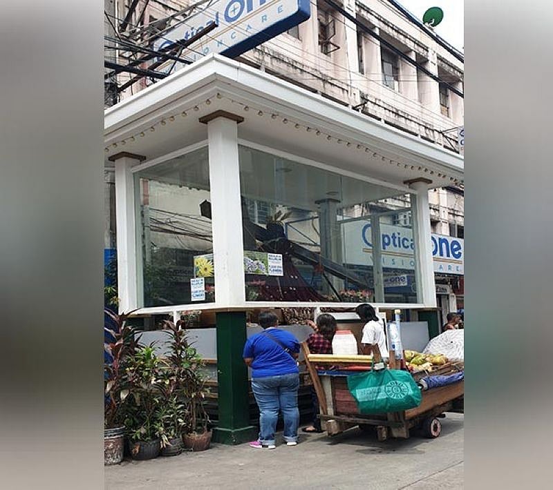 Lighting candles at Quiapo Church