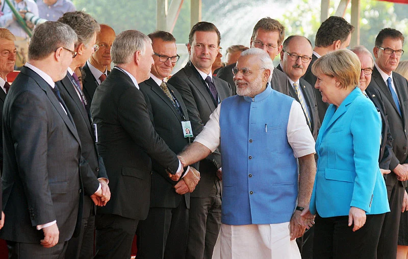 Chancellor Merkel introducing PM Modi to the German delegation