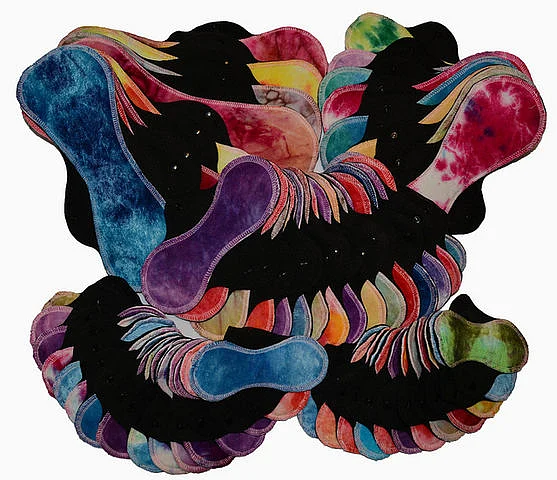Modern reusable cloth pads in differing sizes.
