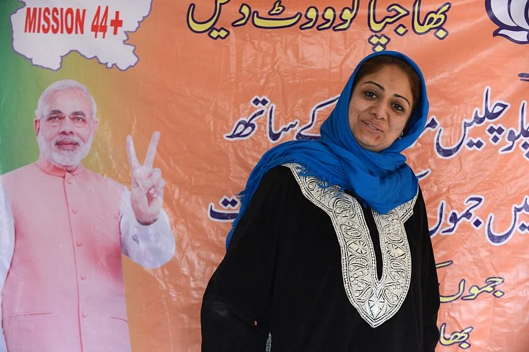 Bharatiya Janta Party (BJP) Srinagar candidate for State Assembly elections Hina Bhat poses at party headquarters in Srinagar.