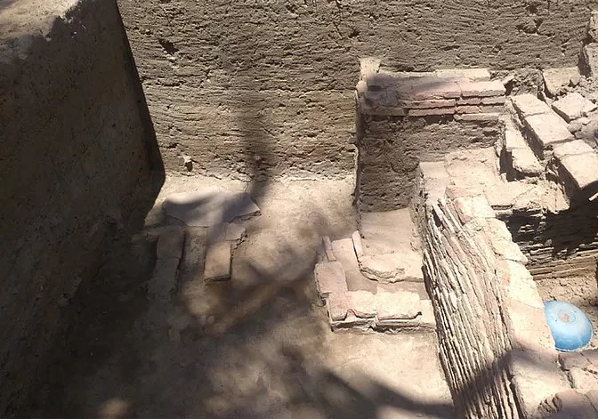 A small enclosure and related drainage structure.