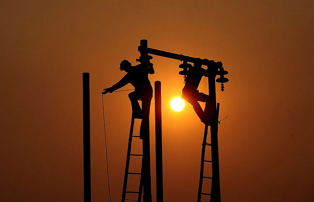 Electric cables being hung (Sanjay Kanojia/AFP/Getty Images) 