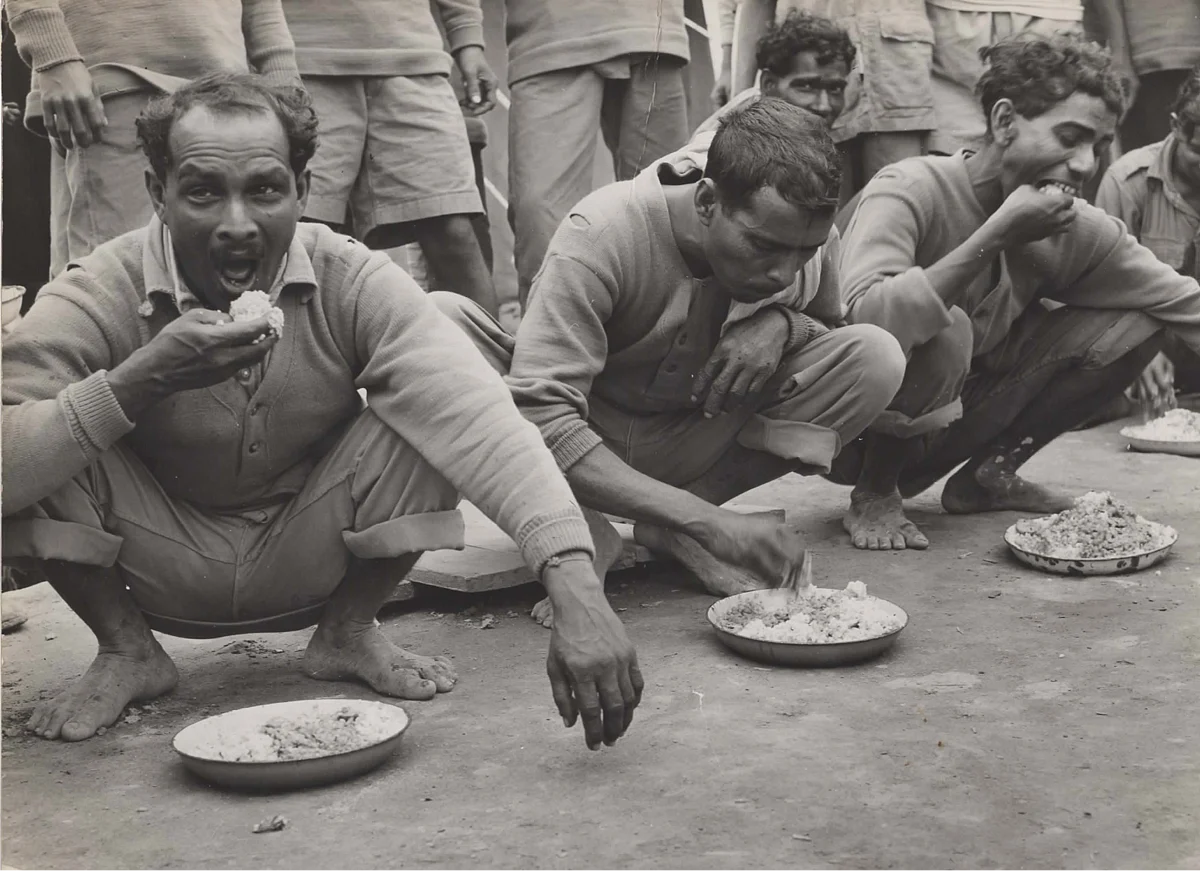 Chabua, Assam, India, April 1944, Indian air freight workers eating rice.(Photo courtesy: Army Air Forces, Air Transport Command, Overseas Technical Unit, Washington DC)