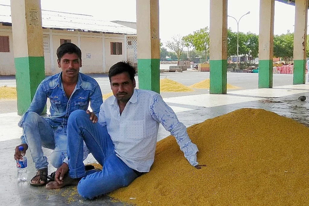 Farmers with their produce at the <i>mandi. </i>