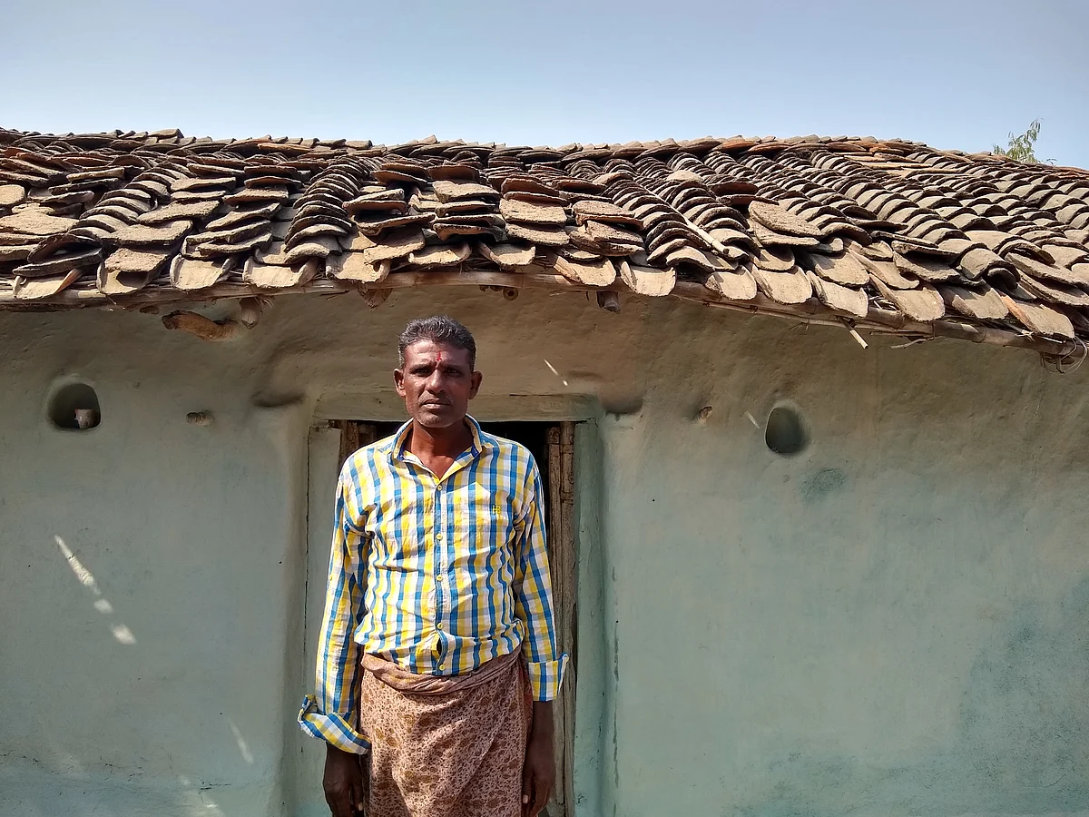 Bhagirath Ahirwal in front of his kutcha house.