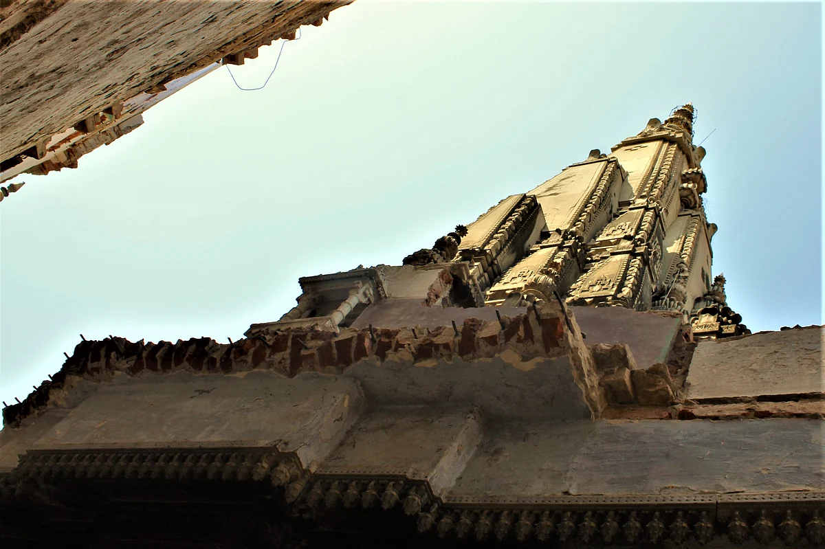 Rods that are seen jutting out of the parapet-like extension at the base of the shikhar of the temple.
