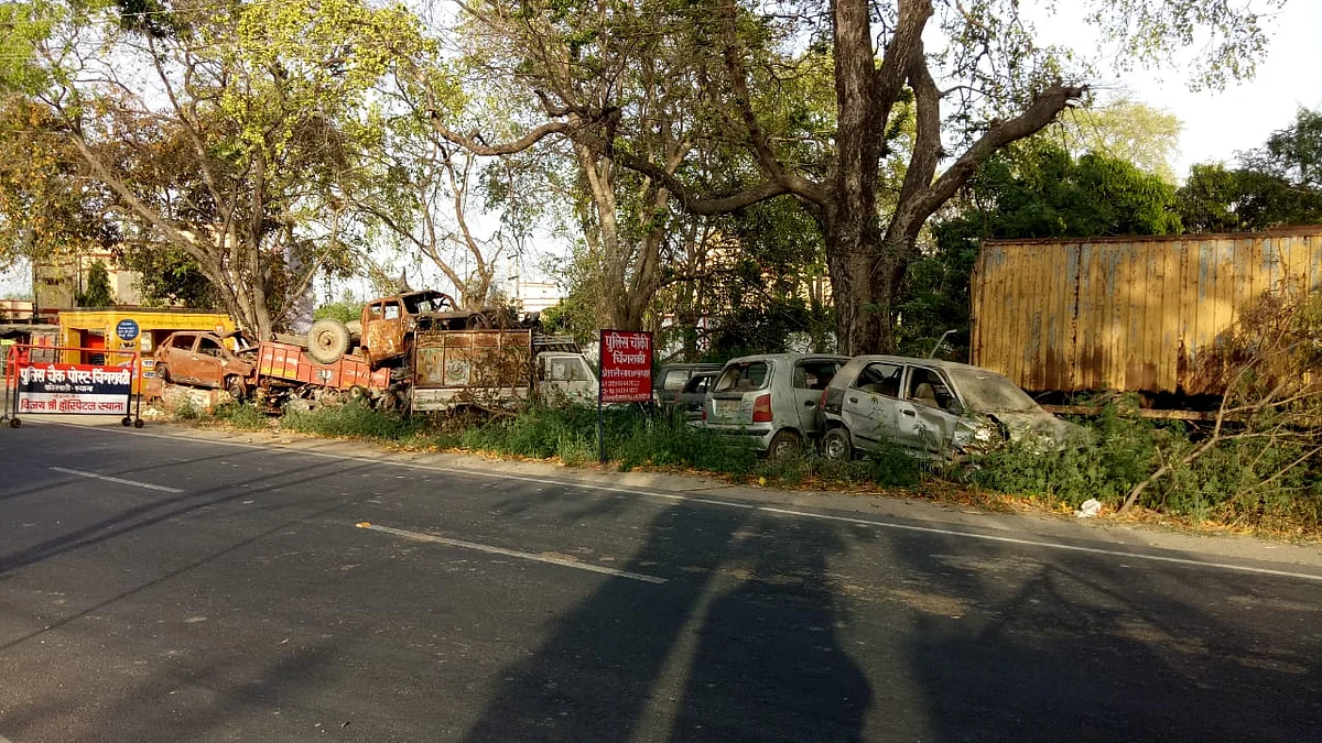 Damaged vehicles piled up across the road from the Chingravati police post. 