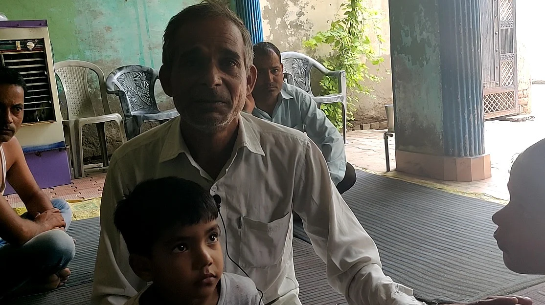 Satbir, Gopal’s cousin, with Gopal’s children