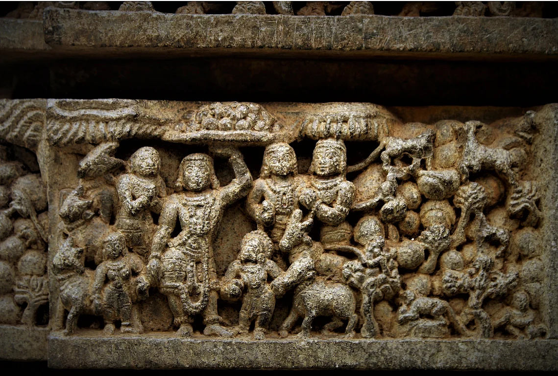 Govardhandhari: Sri Krishna lifts the mountain to protect the cowherds from the fury of Indra. Indra is humbled.