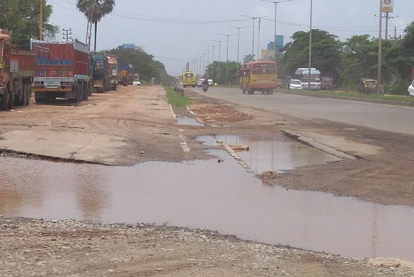A National Highway in the district ravaged by rain. Note the absence of service roads here as well. 