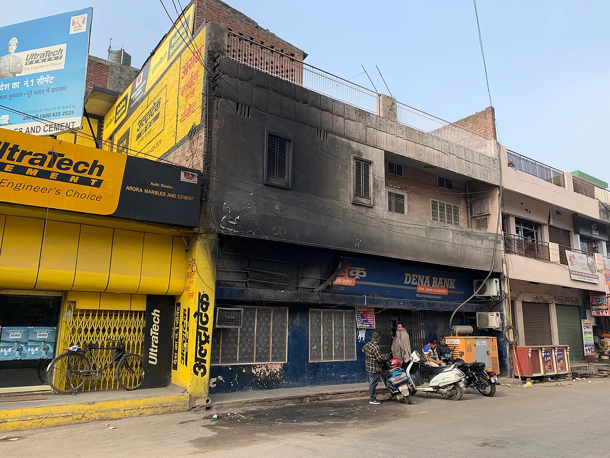 DENA bank branch where four vehicles and an AC was torched by the rioters