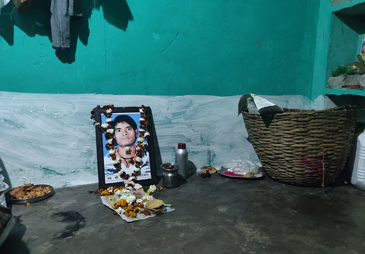 Dhan Prasad Ahirwar’s picture in the room where he was allegedly set afire by neighbours. (Swati Goel Sharma/Swarajya Magazine)