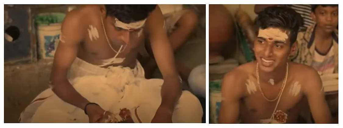 A boy in traditional ritual sacred attire is shown holding a meat piece and smiling.