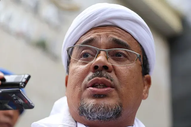 Indonesia Firebrand Islamic Cleric Rizieq Shihab Arrested By Police For Holding Mass Gatherings In Violation Of<script async src=