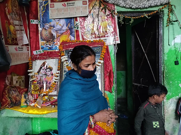 A picture of Dablu’s house. The woman is a relative of Dablu