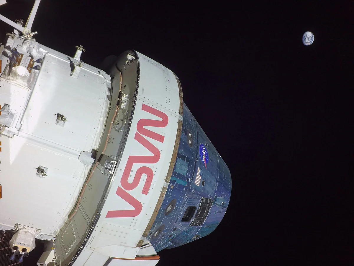 Spacecraft and the earth in one frame