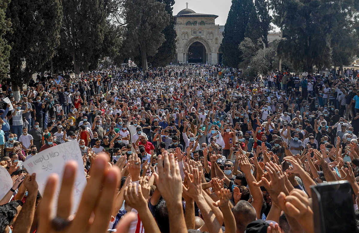 Palestinians gathered to protest against the French president, in the al-Aqsa mosque compound