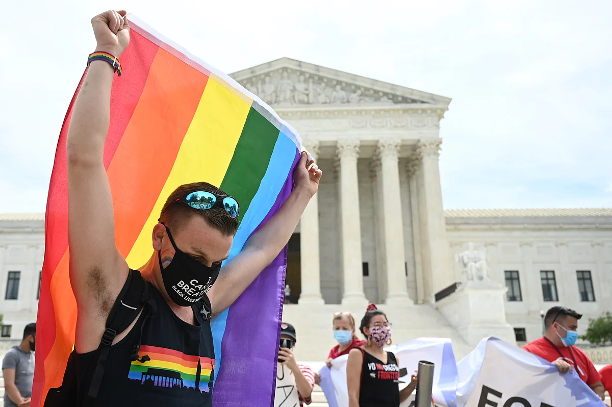 A person celebrates a fedral law that LGBTQ workers from discrimination in Washington,DC