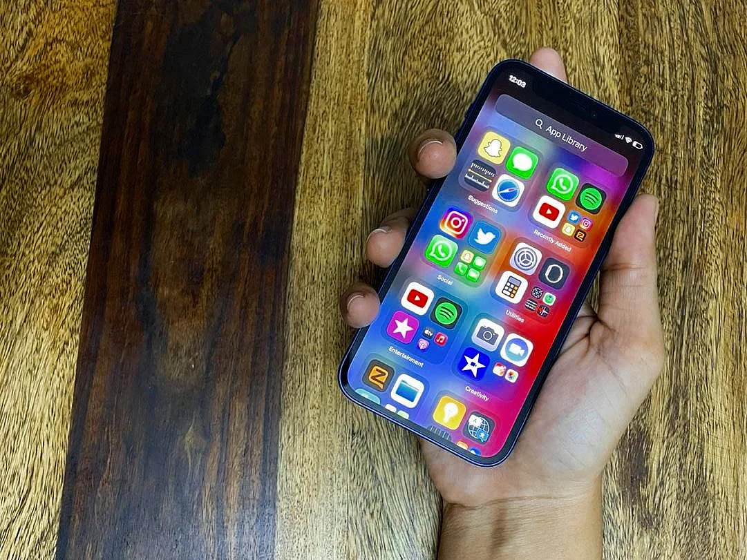 The iPhone 12 Mini fits snugly in your hand.