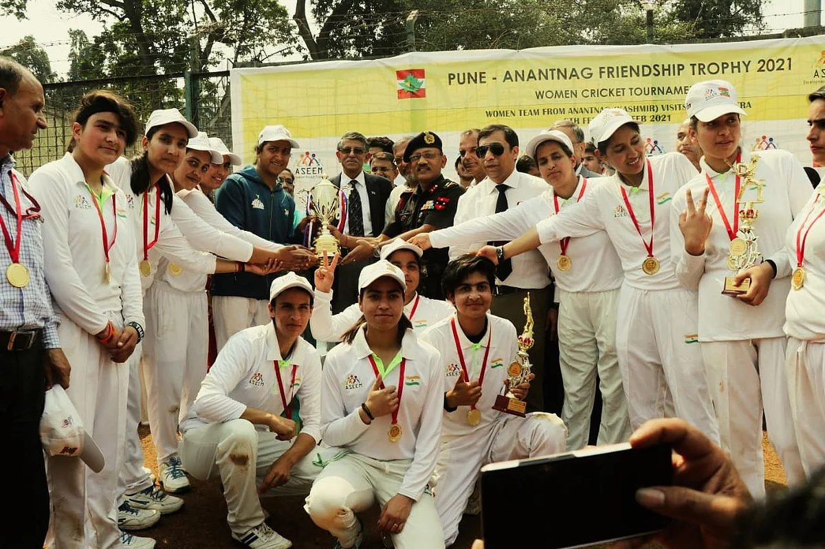 Officials from the Indian Army Southern Command along with the Anantnag XI team members at the Nehru Stadium in Pune
