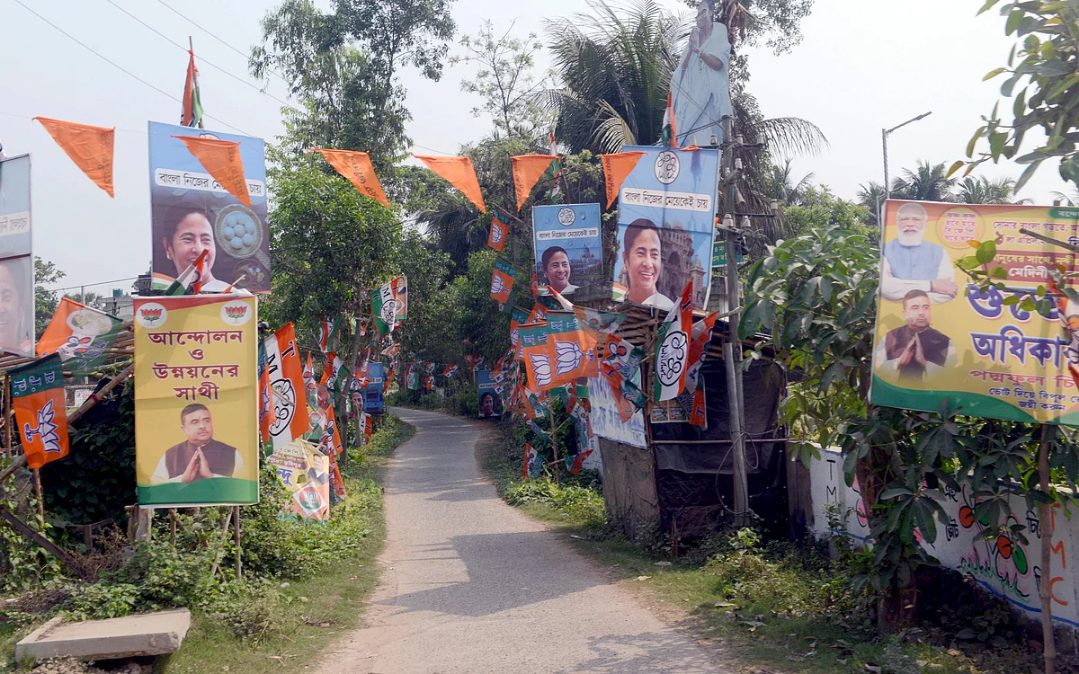 TMC and BJP party posters and flags are seen on the road before the Assembly election, in Nandigram on Wednesday, March 30.