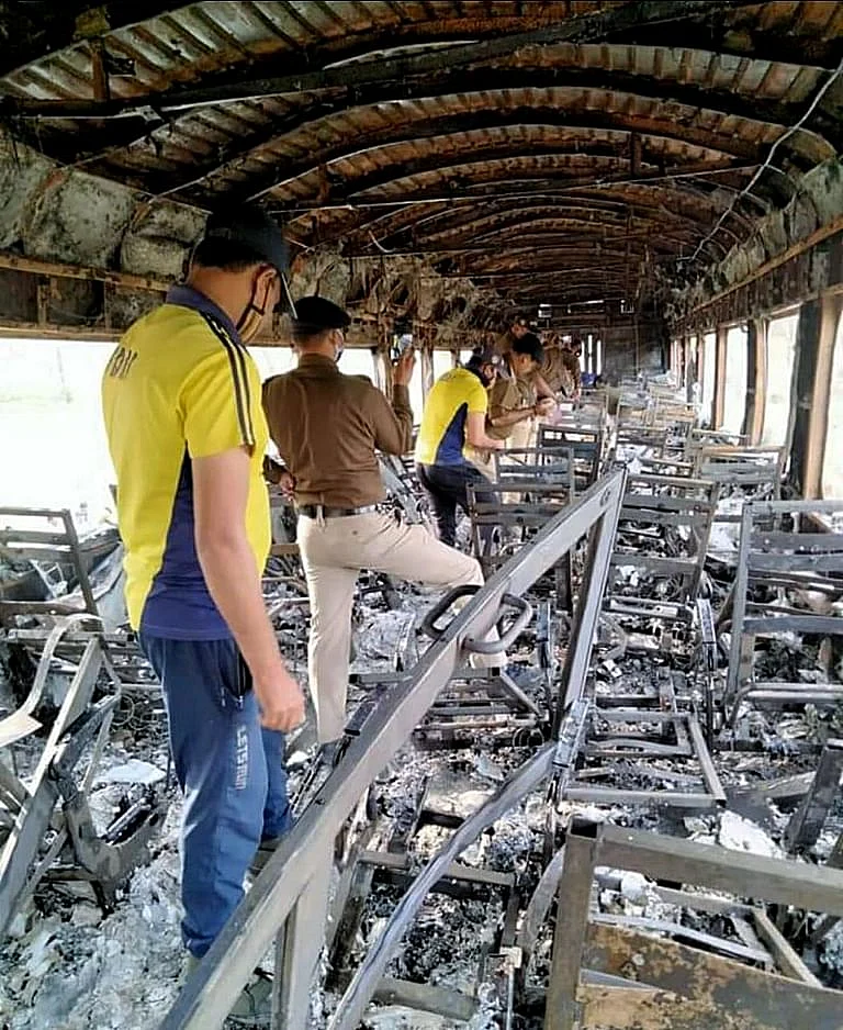 SDRF team inside the burnt compartment of the Delhi-Dehradun Shatabdi Express on Saturday, March 13, 2021. According to the initial probe, the fire was caused due to smoking.