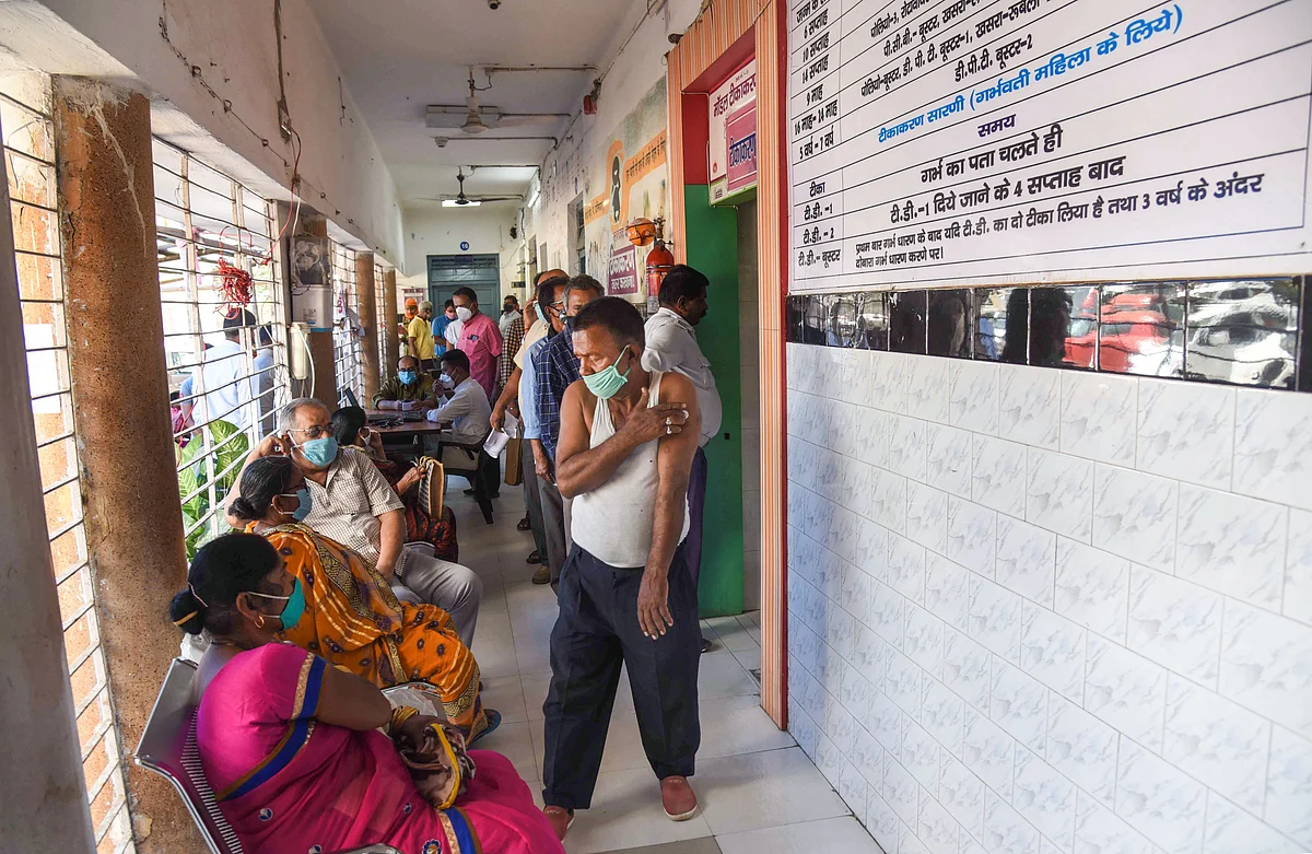 Beneficiaries wait after receiving the first dose of COVID-19 vaccine during the third phase of the countrywide inoculation drive, in Patna, Thursday, April 1, 2021.
