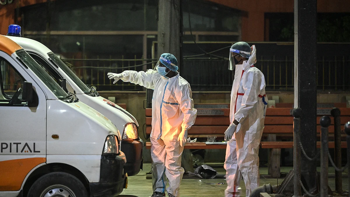 Crematorium staff members stand near ambulances carrying the bodies of COVID-19 victims for a cremation in New Delhi (Image for representational use)