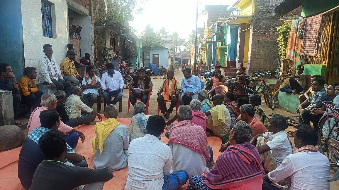 Madhusudan of Motorcycle Diaries listening to the problems of 200 families in Haridapadar village
