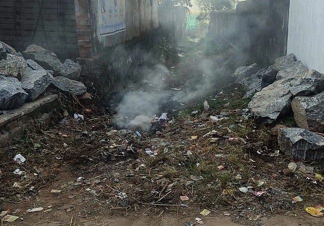 Stones and glass lying on the way to the pond