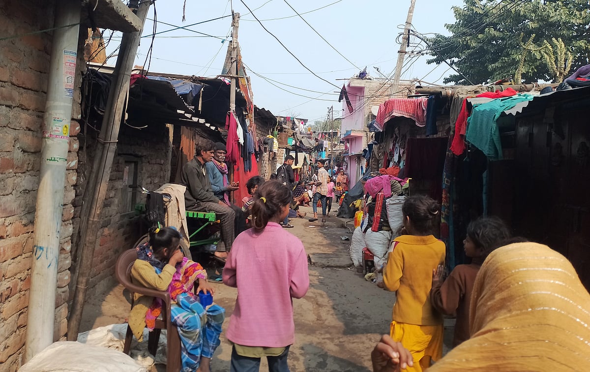 A narrow street between slums