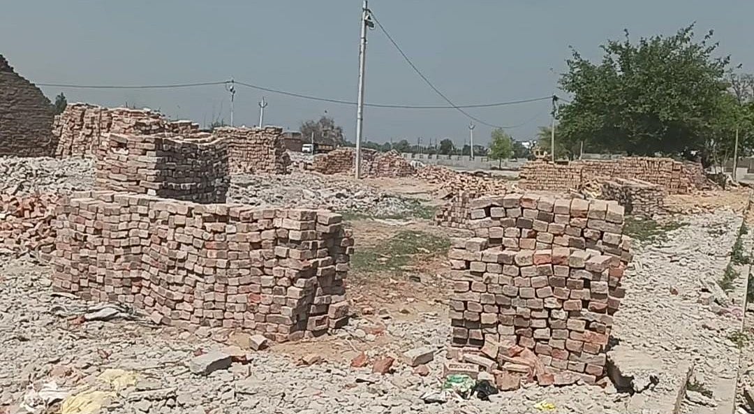 Photograph of the scene of destruction and debris after demolition of a colony in village Dhohariya