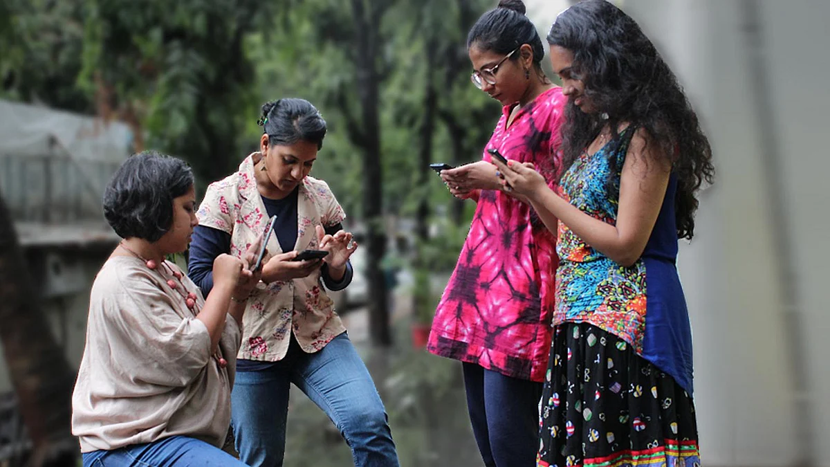 Have we sacrificed conversation for connection? Real picture of four colleagues during an office break. (Photo: The Quint)