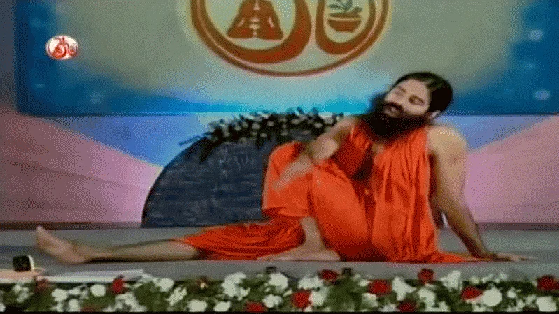 Yoga guru Baba Ramdev doing vakrasan (Source: <a href="https://www.youtube.com/watch?v=IyZcG40xAC8">YouTube/babaramdev</a>)