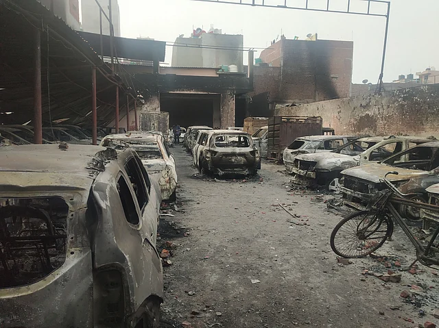 Parking area with over 50 cars in Shiv Vihar was burnt during violence.