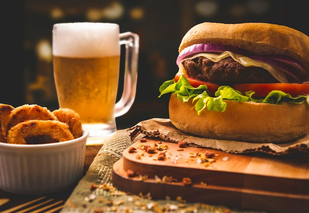 Alcohol and junk food are the two friends your mother warned you about.