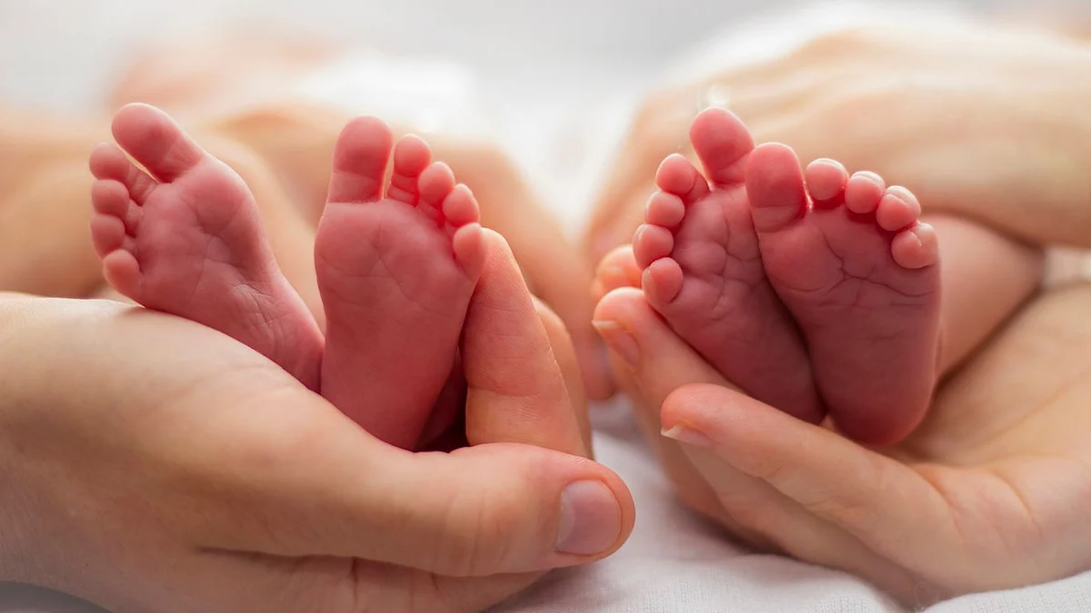 Both the mother and the newborn twins are safe and stable.